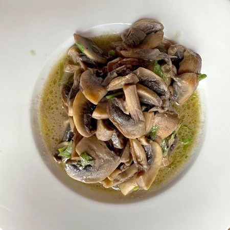 mushrooms with broth and herbs