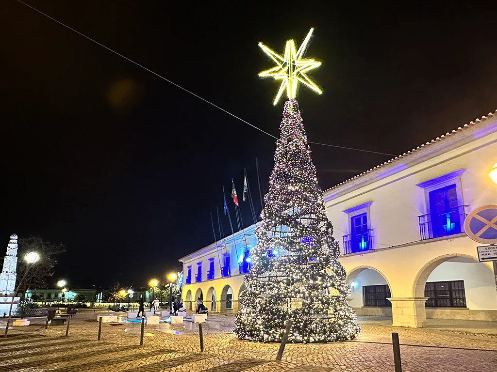 Night photo of a lit up Christmas tree in the Tavira center in Portugal