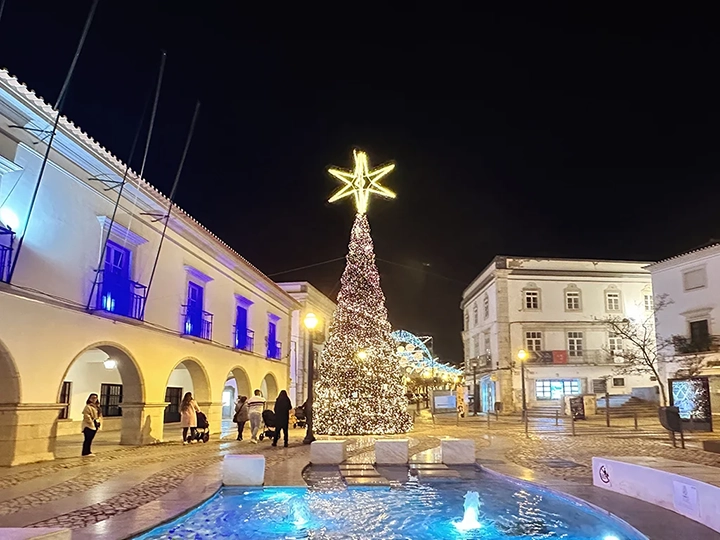 photo of Christmas in Tavira, lit up Christmas street on a sidewalk